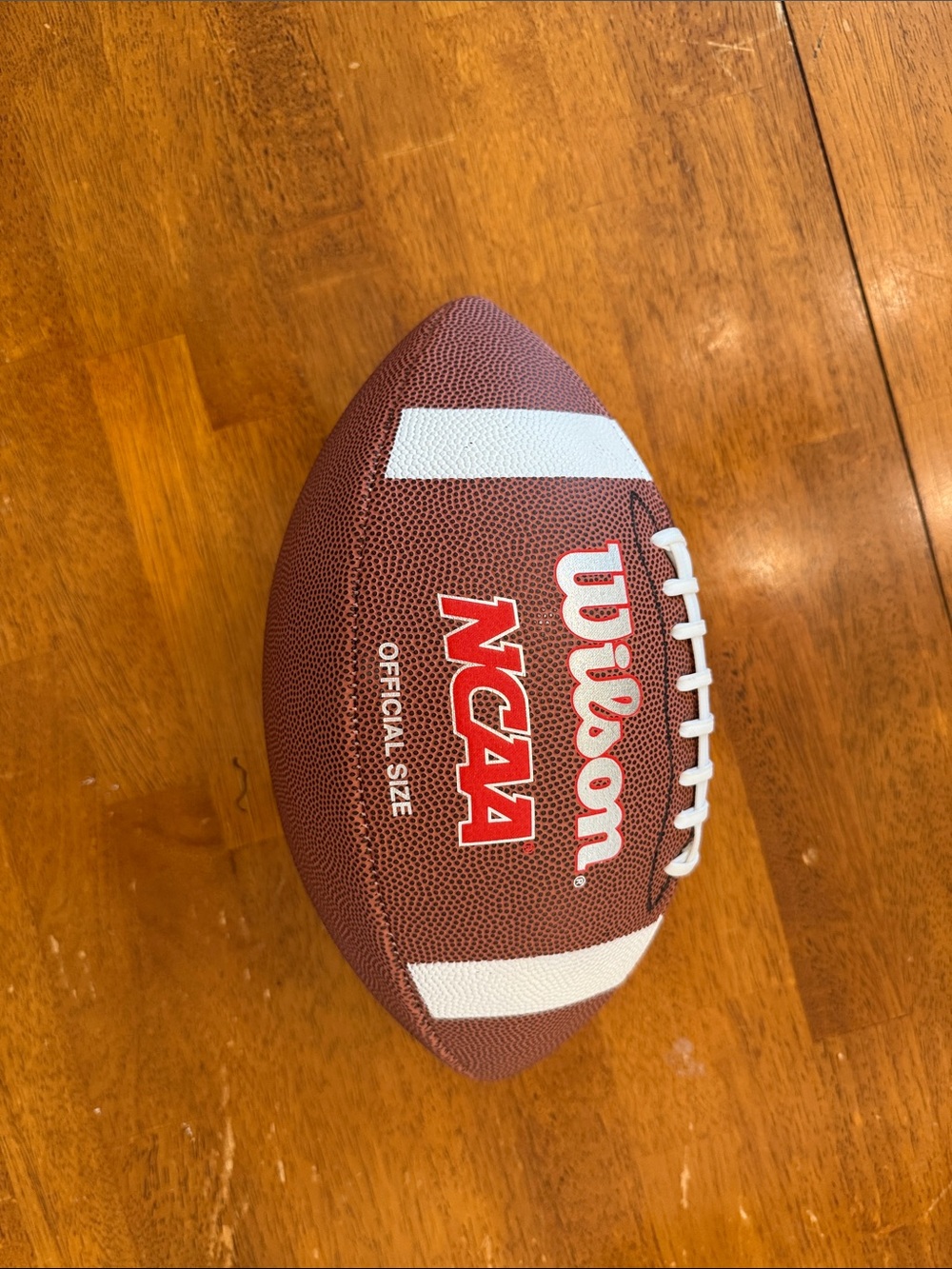 Wilson Brown Football with White Stripes and Red Logo